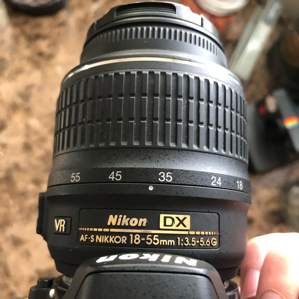 Nikon D3200, charger and case. Great digital camera for a present.